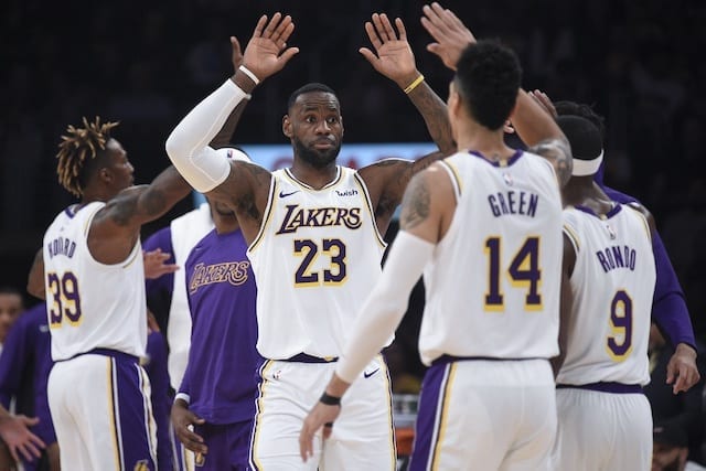 Los Angeles Lakers teammates Danny Green, Dwight Howard, LeBron James and Rajon Rondo celebrate