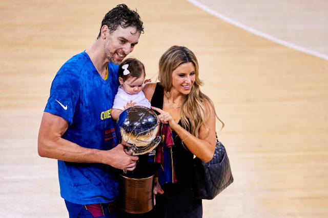 Paul Gasol and wife holding their son.